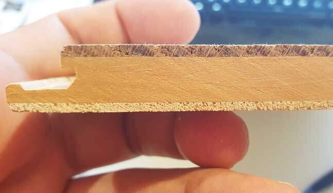 Close-up of a three-layer timber floorboard cross-section